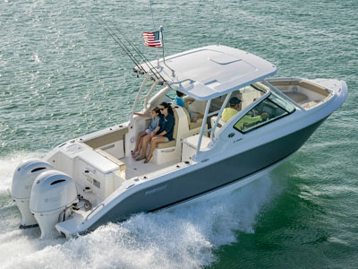 Starboard side shot of family on titanium Pursuit D 266 Denali dual consloe Boat.