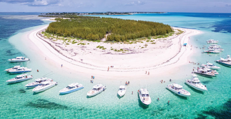 Aerial shot of multiple Pursuit Boats from a rendezvous in the Bahamas from Pursuit magazine EXPLORE.