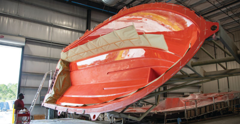 Hull of a boat in the Pursuit Boats factory from Pursuit magazine EXPLORE.