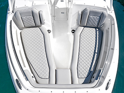 A view of forward lounge seating on the 25’ D 246 Pursuit Luxury Dual Console Boat.