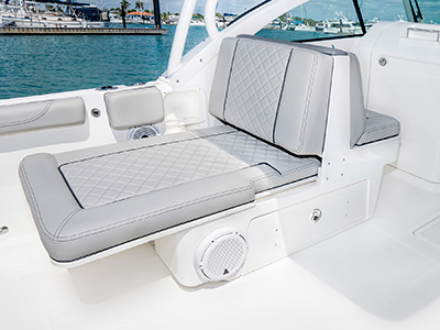 A view extendable lounge seating on the 25’ D 246 Pursuit Luxury Dual Console Boat.