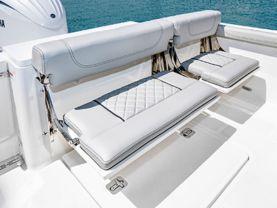 A view of fold away seating open on the 25’ D 246 Pursuit Luxury Dual Console Boat.