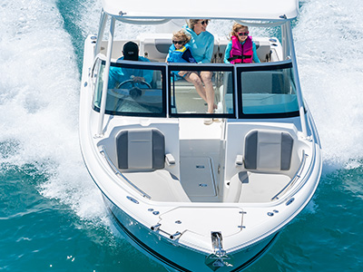 A front view of a bowrider style D 246 Pursuit Luxury Dual Console boat.