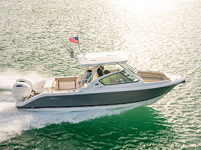 Aerial starboard side running shot of titanium Pursuit D 266 luxury dual console boat.