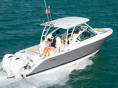 Starboard side shot of family on titanium Pursuit D 266 luxury dual console boat.