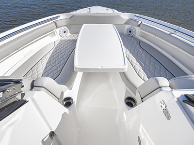 View of forward lounge seating on the D 266 Pursuit Luxury Dual Console Boat with removable table.