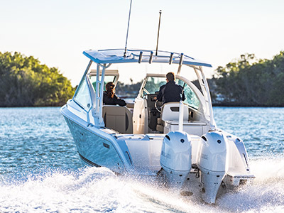Rear view of white Pursuit D 266 luxury dual console boat.