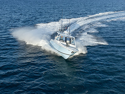 Shot of a Pursuit Boat cruising offshore.