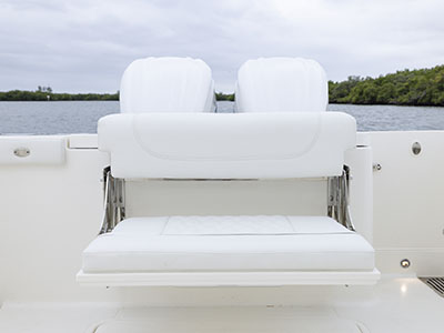 Pursuit Boats patented cockpit foldaway seating with Yamaha engines on a Dual Console boat.