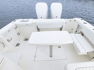 Cockpit on Pursuit Boats 286 Dual Console boat with removable table and fold out seats.