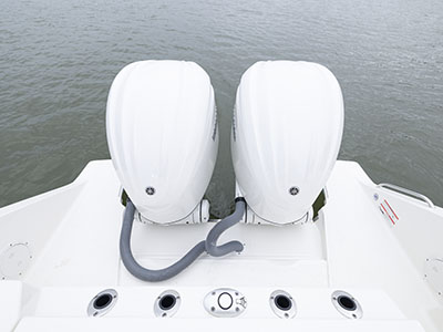 A view of twin Yamaha engines on a Pursuit D 286 Dual Console boat.