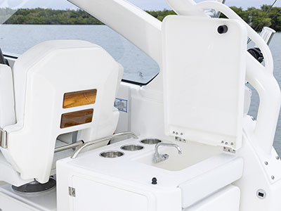Sink, cutting board and cupholders are available in the entertainment center on a Pursuit D 286 boat.