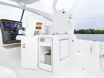 Entertainment center with trash can, storage and sink on a 28ft. Dual Console Pursuit boat.