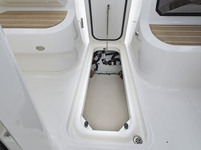 In-floor storage compartment on a Pursuit D 286 Dual Console boat.