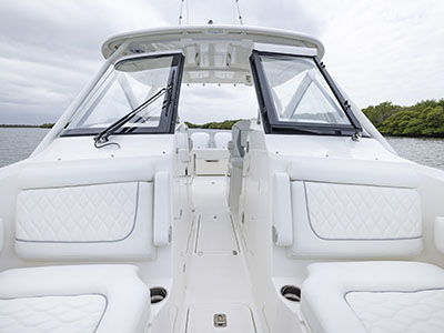Front view of the Pursuit D 286 Dual Console boat with window and door open.
