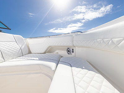 White diamond pattered upholstery on a Pursuit D 306 Luxury Dual Console.