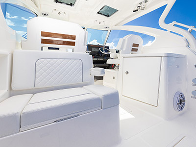 A view of the aft seat and onto the bridge deck on a Pursuit D 306 Luxury Dual Console boat.