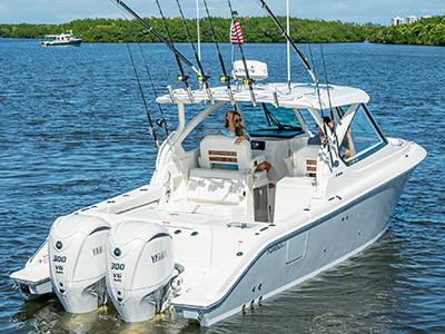 A view of a Pursuit D 306 Luxury Dual Console boat with dual Yamaha engines.