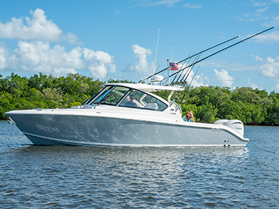 A profile view of a Pursuit D 306 Luxury Dual Console boat.