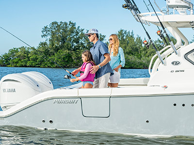 A family fishes off of a Pursuit D 306 Luxury Dual Console boat.