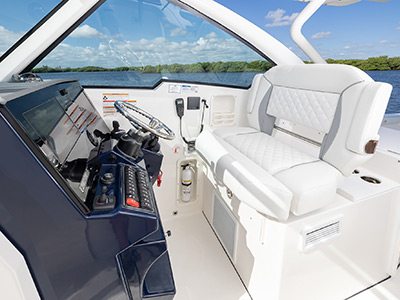 View of helm area of Captains chair on Pursuit Boats Luxury Dual Console