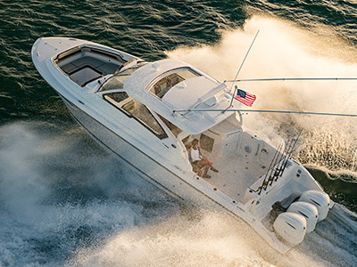 Aerial view of white Pursuit D 365 luxury dual console boat.