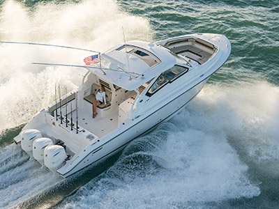Aerial rear three quarter view of white Pursuit D 365 luxury dual console boat.