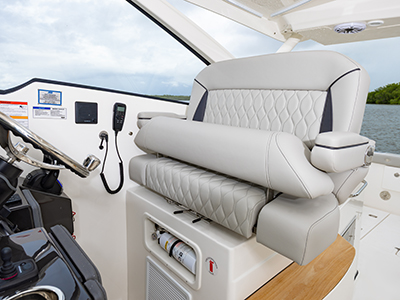 Pursuit D 365 luxury dual console boat swivel helm seat.  One of our cabin cruiser fishing boats.