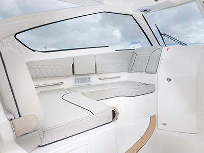 Pursuit D 365 luxury dual console boat bridge lounge seating. One of our cabin cruiser fishing boats.
