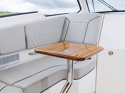 Pursuit D 365 luxury dual console boat bridge lounge seating. One of our cabin cruiser fishing boats.