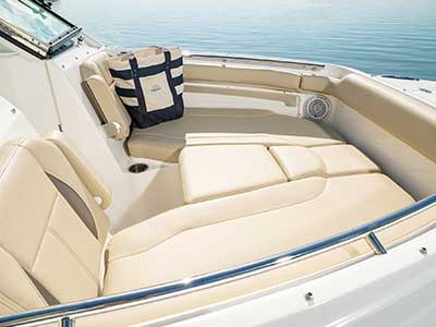 Bow area of Pursuit DC 266 dual console boat with sunpad filler