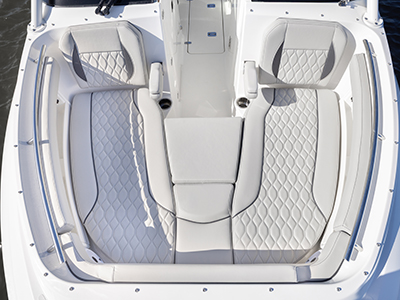 A view of forward lounge seating on the DC 266 Pursuit Luxury Dual Console Boat.
