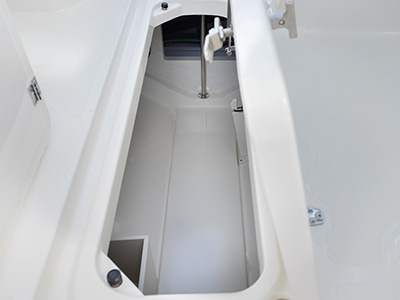 Storage locker open on Pursuit DC 266 luxury dual console boat.