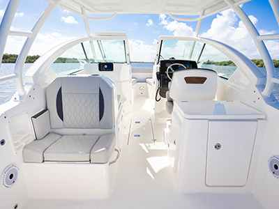 Bridge view of social zone of Pursuit DC 266 luxury dual console boat.