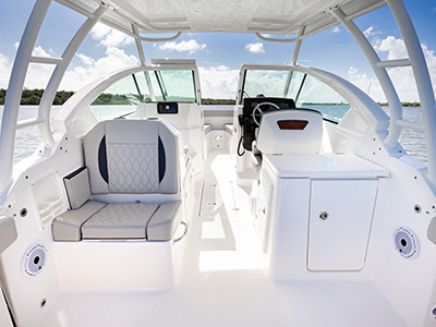 Bridge view of social zone of Pursuit DC 266 luxury dual console boat.