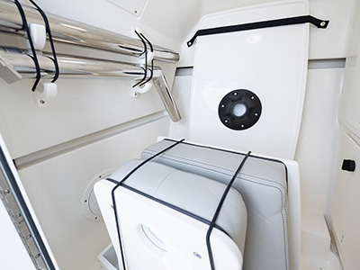 A view of dedicated storage for table on the DC 266 Pursuit Luxury Dual Console Boat