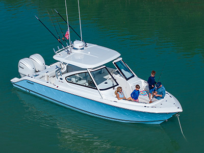 Aerial view of Pursuit Boats Dual Console Boat with a family in the bow.