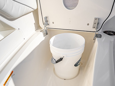 Below seating bucket storage is convenient feature on Pursuit Boats