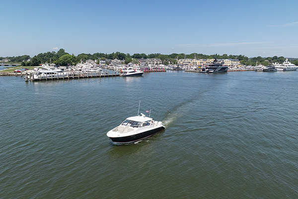 Aerial view of the Pursuit DC 365 Dual Console leaving the harbor.
