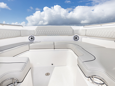 Pursuit DC 365 luxury dual console boat bow social zone.