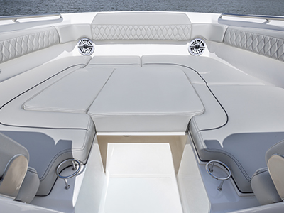 Bow area of Pursuit DC 365 luxury dual console boat with sunpad filler
