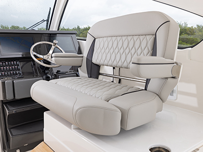 Pursuit DC 365 luxury dual console boat swivel helm seat.  One of our cabin cruiser fishing boats.