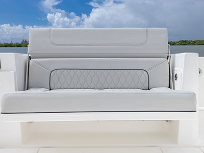 Pursuit DC 365 luxury dual console boat cockpit social zone with seats down.