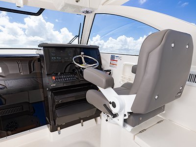 Detail view of OS 355 offshore boat helm seat with Garmin electronics.