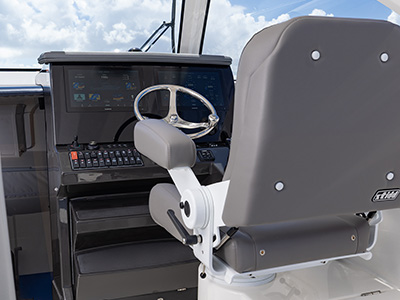 Detail view of OS 355 offshore boat helm seat with Garmin electronics.