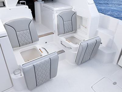 Detail view of OS 355 offshore boat Molded Port and Starboard Aft Facing Seats with Insulated Storage Below.