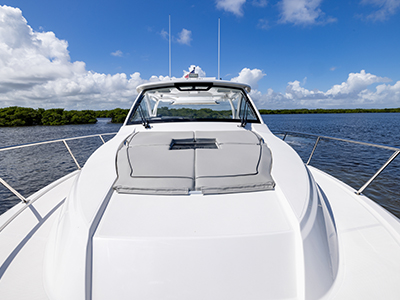 Image of sunpad and optically clear windshield on a Pursuit Boat OS 355 Offshore cabin cruiser fishing boat.