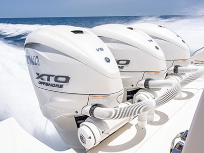 Close view of a Yamaha XTO Offshore outboard cowling on a Pursuit OS 445 underway.