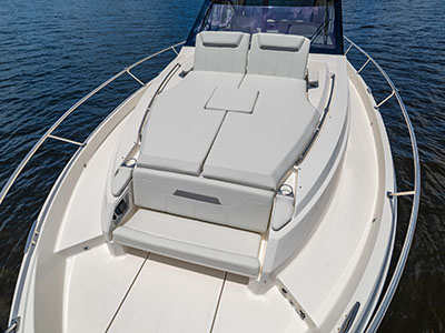 Bow lounge seating with adjustable backrests aboard a Pursuit OS 445.