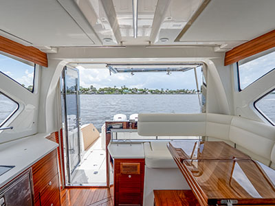 Salon of a Pursuit OS 445 looking aft through the door to the cockpit.